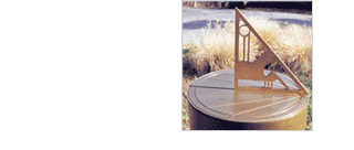 Great American Ironworks - custom designed sundial by Bob Bartle. He also works on fireplace screens, lighting fixtures, railings, sundials, spiral stairdcases, and curtain rods
